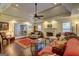 Cozy living room boasts hardwood flooring, fireplace, and lots of natural light at 220 Edna Ruth Ln, Mcdonough, GA 30253