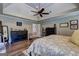 Bright main bedroom with trey ceiling, neutral decor, dark furnishings and hardwood style floors at 220 Edna Ruth Ln, Mcdonough, GA 30253