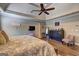 Sunlit main bedroom with trey ceilings, ceiling fan, hardwood floors and neutral decor at 220 Edna Ruth Ln, Mcdonough, GA 30253