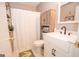 Classic bathroom features neutral tones and a vanity cabinet for storage and organization at 120 Trisha Ln, Grantville, GA 30220