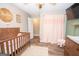 Charming Bedroom featuring a warm color palette, wood floors, and natural lighting at 120 Trisha Ln, Grantville, GA 30220