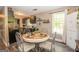 Cozy dining area with bright windows and table with seating for four people at 120 Trisha Ln, Grantville, GA 30220
