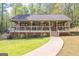 Attractive ranch-style home with inviting front porch and lush green surroundings at 120 Trisha Ln, Grantville, GA 30220