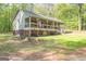 Beautiful craftsman style home with a covered front porch, set on a manicured green lawn at 120 Trisha Ln, Grantville, GA 30220