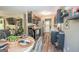 Open-concept kitchen featuring stainless appliances, dark cabinets, with dining area at 120 Trisha Ln, Grantville, GA 30220