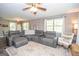 Comfortable living room featuring a spacious gray sectional sofa and natural light at 120 Trisha Ln, Grantville, GA 30220