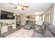 Comfortable living room featuring modern furnishings, a ceiling fan, and a view into the kitchen and dining area at 120 Trisha Ln, Grantville, GA 30220