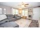 Cozy living room with a plush gray sectional, natural light, and stylish decor at 120 Trisha Ln, Grantville, GA 30220