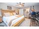 Comfortable main bedroom featuring a ceiling fan and adjoining bath at 120 Trisha Ln, Grantville, GA 30220