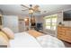 Main bedroom featuring an adjacent bathroom and desk setup by the window at 120 Trisha Ln, Grantville, GA 30220