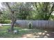 Fenced backyard with mature trees and bench offers a relaxing outdoor space at 4793 Davenport Nw Trce, Acworth, GA 30101