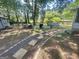 Landscaped backyard with stepping stone path, seating area, grill, storage shed and above-ground pool at 4793 Davenport Nw Trce, Acworth, GA 30101