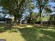 A shady backyard has a shed, swing, and seating, offering a relaxing outdoor space at 4793 Davenport Nw Trce, Acworth, GA 30101