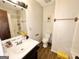 Bathroom with a single sink vanity, toilet, and tiled flooring at 4793 Davenport Nw Trce, Acworth, GA 30101