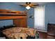 Comfortable bedroom features bunk beds with a unique lion print blanket and mini fridge at 4793 Davenport Nw Trce, Acworth, GA 30101