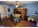 Cozy bedroom with blue walls features bunk beds with a unique lion print blanket at 4793 Davenport Nw Trce, Acworth, GA 30101