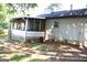 Back of home featuring a screened-in porch and backyard at 4793 Davenport Nw Trce, Acworth, GA 30101