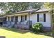 Charming single-story home featuring a cozy front porch and landscaped yard at 4793 Davenport Nw Trce, Acworth, GA 30101