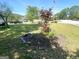 Home featuring a well-maintained lawn and landscaping, bordered by a street on one side at 4793 Davenport Nw Trce, Acworth, GA 30101