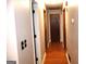 Long hallway features wood-look floors and doors at 4793 Davenport Nw Trce, Acworth, GA 30101
