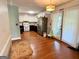 View of kitchen with black appliances, white cabinets, a stainless refrigerator and hardwood floors at 4793 Davenport Nw Trce, Acworth, GA 30101