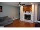 Cozy living room features a stone fireplace and hardwood floors at 4793 Davenport Nw Trce, Acworth, GA 30101