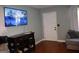 Comfortable living room features a television and hardwood floors at 4793 Davenport Nw Trce, Acworth, GA 30101