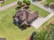 Overhead view of a home featuring lush lawn, mature trees, long drive, and mulch at 189 Willowleaf Way, Sharpsburg, GA 30277