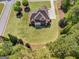 Overhead shot of a two-story home with a well-kept lawn and mulch at 189 Willowleaf Way, Sharpsburg, GA 30277