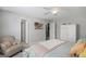 Bright bedroom with a white dresser, plush bedding, and neutral colors for a tranquil space at 189 Willowleaf Way, Sharpsburg, GA 30277
