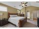 This primary bedroom boasts carpeted floors and a vaulted ceiling at 189 Willowleaf Way, Sharpsburg, GA 30277