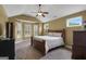 Vaulted ceiling bedroom features a large window seat and carpeted floors at 189 Willowleaf Way, Sharpsburg, GA 30277