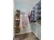 Walk-in closet with built-in shelving and plenty of storage space for clothes and shoes at 189 Willowleaf Way, Sharpsburg, GA 30277