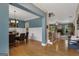 Open-concept dining and living areas showcasing hardwood floors and a cozy fireplace at 189 Willowleaf Way, Sharpsburg, GA 30277