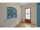 Inviting entryway with hardwood floors, a decorative niche, and a stylish front door at 189 Willowleaf Way, Sharpsburg, GA 30277