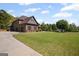 Beautiful two-story home with a well-maintained lawn, manicured landscaping, and an attached three-car garage at 189 Willowleaf Way, Sharpsburg, GA 30277