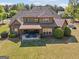 Aerial view of a home with a covered patio and outdoor seating area at 189 Willowleaf Way, Sharpsburg, GA 30277
