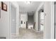 Upstairs hallway with carpeted floors and doorways to multiple rooms providing easy access at 189 Willowleaf Way, Sharpsburg, GA 30277