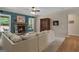 Comfortable living room featuring a stone fireplace and ample seating at 189 Willowleaf Way, Sharpsburg, GA 30277