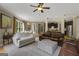 Open living space with hardwood floors flows seamlessly into dining area and kitchen at 189 Willowleaf Way, Sharpsburg, GA 30277