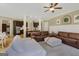 Open concept living room features hardwood floors, modern furnishings, and neutral decor at 189 Willowleaf Way, Sharpsburg, GA 30277