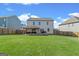 Spacious backyard features a covered patio and ample green space, great for outdoor activities and relaxation at 150 Ivy Chase Loop, Dallas, GA 30157