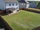 Expansive backyard with a covered patio area, ideal for outdoor entertaining and relaxation at 150 Ivy Chase Loop, Dallas, GA 30157