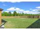 Lush backyard with a privacy fence surrounding the property, offering a secure and peaceful outdoor retreat at 150 Ivy Chase Loop, Dallas, GA 30157