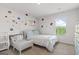 Bright bedroom featuring a bed and crib with natural light at 150 Ivy Chase Loop, Dallas, GA 30157