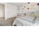 Bright bedroom featuring a bed and crib with natural light at 150 Ivy Chase Loop, Dallas, GA 30157