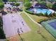 Aerial view of community amenities including a playground, pool, tennis court, and basketball court at 150 Ivy Chase Loop, Dallas, GA 30157