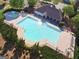 Aerial view of a community pool with ample deck space for lounging and a separate splash pad at 150 Ivy Chase Loop, Dallas, GA 30157