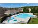 Community pool and kiddie pool area with a clubhouse and sun deck surrounded by mature trees at 150 Ivy Chase Loop, Dallas, GA 30157