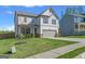 Beautiful two-story home boasting a manicured lawn and an attached two-car garage in a suburban setting at 150 Ivy Chase Loop, Dallas, GA 30157